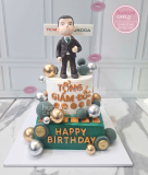 Bánh sinh nhật tặng sếp nam 2 tầng nặn hình Tổng Giám Đốc 3D tại Hunnie Cake